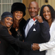 Errol Brown with his wife, Ginette (second from left), and daughters, Leonie (left) and Colette, after receiving an MBE for services to pop music from Queen Elizabeth II at Buckingham Palace in London Nov. 27, 2003
FIONA HANSON/AFP/Getty Images